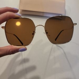 Brown Sunglasses with gold frame.